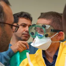 Putting on the personal protective equipment (PPE)